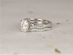 a white gold engagement ring set with an oval cut diamond