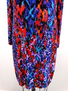 "This is an exquisite piece from Black Tie Oleg Cassini. It's embellished and hand beaded with bright sequins and beads. It's in perfect condition! Bust - 36\" Waist - 32\" Hips - 38\" Length - 37\" Size - US 8 This dress comes from a pet-free and smoke-free home. If you would like more info or have any questions, please don't hesitate to ask!" Evening Multicolor Beaded Dresses, Multicolor Sequined Dresses For Celebrations, Multicolor Embellished Sequin Dress For Cocktail, Festive Beaded Sequin Dress For Night Out, Embellished Multicolor Sequin Dress For Night Out, Multicolor Embellished Sequin Dress For Night Out, Multicolor Sequin Holiday Dress For Evening, Multicolor Sequin Dress For Festive Party Season, Multicolor Sequin Dress For Party Season