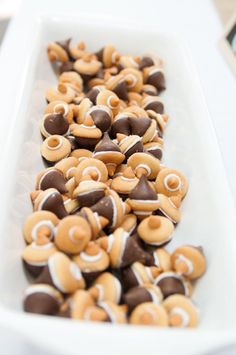 there are many different types of pretzels in the tray on the table together