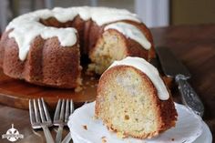 a bundt cake with white icing on a plate