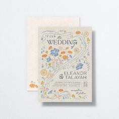 a wedding card with flowers on it