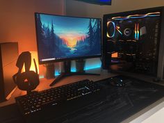 two computer monitors sitting next to each other on a desk