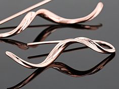 Timna Jewelry Collection™ twisted copper drop earrings. Measures approximately 1.56"L x 0.13"W. Fish hook backing.