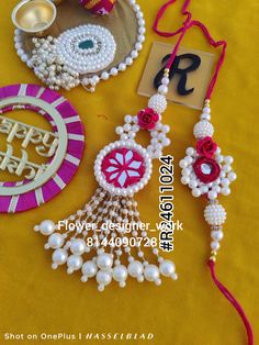 some beads and other items on a yellow table cloth with the words happy diwaler work