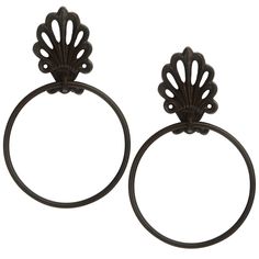 two metal rings with an ornate design on the top and one has a circular handle