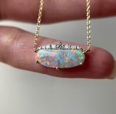 14K Yellow gold necklace with Australian Opal and Diamonds Metal: 14K yellow gold Opal size: 16.5x6mm (1.5 ct) Diamonds: 1-2.2mm VS (0.17ct tw) Chain: 1mm cable Length: 16.5″ Natural untreated stones. Not man made. Not lab created. Australian Opal Necklace, Opal Necklace Vintage, Gold Opal Necklace, Opal Necklace Gold, Australian Opal Jewelry, Black Gold Jewelry, Necklace Opal, 14k Yellow Gold Necklace, Opal Pendant Necklace