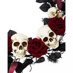 two skulls and three red roses are arranged in the shape of a letter o on a white background