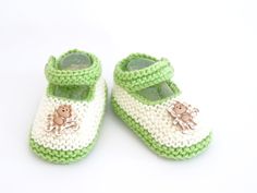 "Looking for a super cute pair of hand knitted baby shoes for that extra special tiny man or lady in your life?  This hand knitted, classic style, pair of baby shoes in lime green and cream with a white and tan gingham monkey button and functional straps, which will keep the shoes on tiny feet (no more lost shoes when out on the go) will compliment or dress up any outfit in your baby's wardrobe and are a perfect style for both baby girls and boys. With many beautiful designs in both solid, two t Knitted Baby Shoes, Baby Boy Booties, Knit Baby Shoes, Handmade Baby Shower Gift, Winter Baby Clothes, Sock Booties, Pink Baby Girl, Purple Baby, Baby Slippers