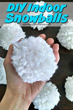 a hand holding a snowball made out of foam and cotton balls with text overlay that reads diy indoor snowballs