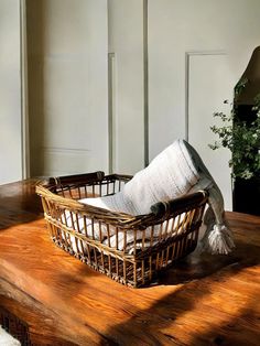 a basket sitting on top of a wooden table