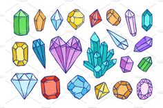 a bunch of different colored crystals on a white background