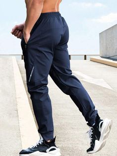 Waist Line:Natural \nFit Type:Regular Fit \nType:Sports Pants \nColor:Blue \nPattern Type:Letter \nLength:Long \nFabric:Slight Stretch \nMaterial:Fabric \nComposition:96% Polyester \nComposition:4% Elastane \nCare Instructions:Machine wash or professional dry clean \nSheer:No \n Men Sport Pants, Sports Pants, Boyfriend Style, Yoga For Men, Winter Sports, Mens Swimwear, Sport Pants, Blue Fabric, Yoga Fitness