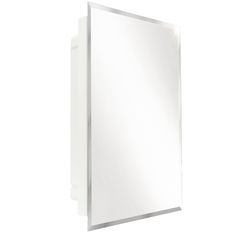 a white bathroom mirror mounted on the wall