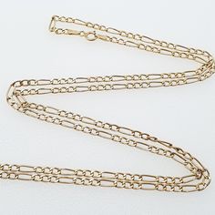 A quality vintage Figaro chain link necklace which is fairly long in length, crafted from 9ct gold. The chain is fairly light for its length hence the great price. WEIGHT: 2.04g LENGTH: approx. 60 cm or 24" WIDTH: 2.4 mm Stamped "375" (c) 1990s Please check out the other items in my shop. Be sure to view all photos and videos for condition and read the titles and descriptions. Sizes are in the latter photos.  Don't hesitate to send me a message with any queries. All my items are used, some are very old, therefore may show signs of wear or use and are all sold as seen. I'll try and point out any defects but please satisfy yourself using the pictures, what you see is what you will receive. I test all precious metals with acids and gemstones with a thermal conductivity meter so you can buy wi Gold Necklace Chain, Mens Jewellery, Figaro Chain, Gold Chain Necklace, Chain Link Necklace, Link Necklace, Vintage Jewellery, Necklace Chain, Last Minute Gifts