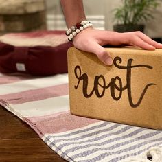 a person's hand on top of a box that says foot