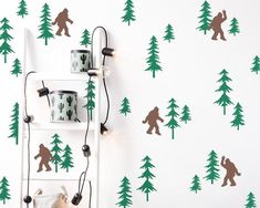 there is a bear wall decal on the wall next to a ladder with lights