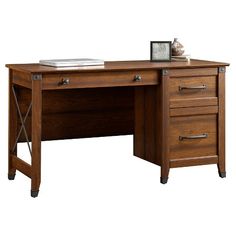 a wooden desk with two drawers and a clock on top