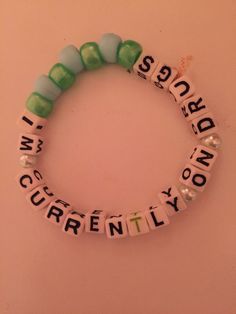 a beaded bracelet with words written on it