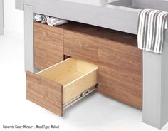 an open drawer in front of a sink