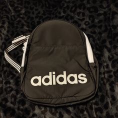 Price Firm! Bundle To Save! Brand New, Never Used Absolutely Beautiful Mini Adidas Backpack Front Zipper Pocket Double Zip Main Closure Padded Back Adjustable Straps Interior Zip Mesh Pocket Approx Size: 10.5" X 9" X 4" Deep Matte Black With White Adidas Writing White Hardware Striped Straps Adidas Mini Shoulder Bag, Adidas Mini Backpack, Adidas Backpack, White Hardware, Adidas Bags, Herschel Heritage Backpack, White Adidas, Mini Backpack, Black Adidas