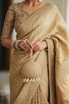 A photo of a Pakistani bride wearing a vintage bridal outfit. She is wearing a champagne-toned saree with intricate detailing. Bridal Outfit, Indian Outfit, Vintage Bridal, Bride Wear