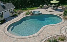 an above ground swimming pool surrounded by patio furniture