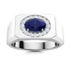 a white gold ring with a blue sapphire and diamonds on the side, set in 18k white gold