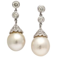 Ultra rich Bulbous South Sea Pear Diamond Capped Drops suspended from Bezel set Diamond Caps. Set in Platinum. Inspired by Vermeer Pearl Earrings. So classic. Pearl Earring Aesthetic, Bezel Set Diamond Earrings, Ruby And Pearl, Matching Wedding Rings, Colored Diamond Rings, Pearl Bridal Jewelry, Platinum Earrings, Bridal Earrings Drop, Pearl Necklace Earrings