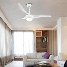 a living room with a white ceiling fan