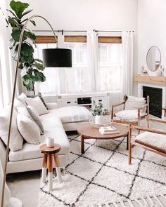 a living room filled with furniture and a fire place