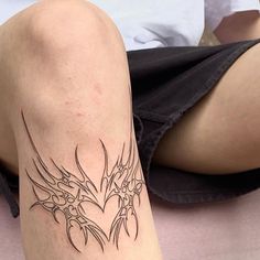 a person with a tattoo on their leg