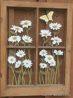 a window with flowers painted on it