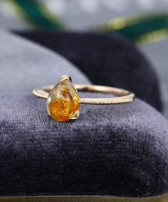 ++++++++++++++Stone SPECIFICATIONS++++++++++++++Amber engagement ringMain Stonecenter stone: 6*8mm pear shaped++++++++++++++Band SPECIFICATIONS++++++++++++++Can be made in 14k or 18k rose gold / white gold / yellow gold.The bandwidth is about 1.5 mm.The band thickness is about 1.2 mm.++++++++++++++ MAKING & SHIPPING TIME++++++++++++++Handmade in my American studio，The making process is about 2-3 weeks.Us domestic shipping time: 3-5 daysInternational shipping time: 5-12 days for most destinat Amber Engagement Ring Vintage, Yellow Gold Teardrop Jewelry For Proposal, Gold Gemstone Stackable Rings For Wedding, Gold Stackable Rings With Gemstones For Wedding, Art Deco Yellow Gold Diamond Ring As A Gift, Art Deco Yellow Gold Diamond Ring As Gift, Art Deco Yellow Gold Diamond Ring Gift, Art Deco Gold Diamond Ring For Gift, Gold Teardrop Rings For Proposal