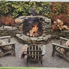 an outdoor fire pit with chairs around it