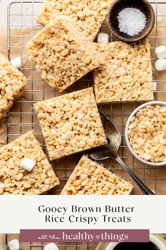 some brown butter rice crispy treats are on a cooling rack with marshmallows