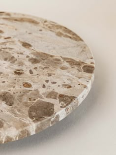 a marble plate sitting on top of a white table