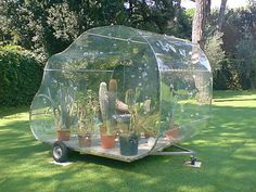 an inflatable bubble tent with plants inside