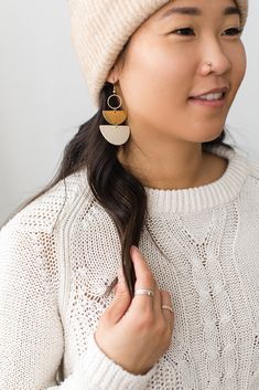 Cozy vibes in one of our best selling earrings shapes! This beige leather is soft, neutral and perfect for a delicate statement. •••••••••••••••••••••••••••••••••••••••••••••••••••••••••••••• • ORDERING • These leather earrings measure approx 1 1/2" wide, 2 3/4" drop with hook. These earrings come with raw brass or 14K gold fill hooks, and feature raw brass accents. Please note raw brass will naturally oxidize over time, creating a beautiful vintage like patina on your earrings. Each pair of ear Handmade Minimalist Beige Jewelry, Minimalist Handmade Beige Jewelry, Beige Dangle Earrings For Everyday, Beige Dangle Jewelry For Everyday, Adjustable Beige Earrings For Everyday, Trendy Adjustable Beige Earrings, Everyday Beige Dangle Earrings, Everyday Beige Dangle Jewelry, Minimalist Everyday Beige Jewelry