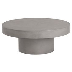 a round concrete table top with an oval base in the middle, on a white background