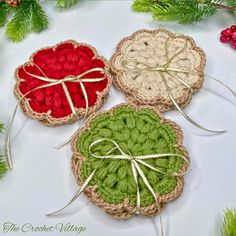 three crocheted coasters tied with twine on top of a white table