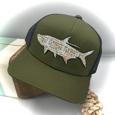 This hat is printed on a variety of Richardson and Pacific snap-back mesh hats and comfort foamies to fit your individual needs. These feature a made-in-USA leather patch with vibrant Florida orange license plates on the brow! These iconic Florida orange plates bring back sunny memories of enjoying targeting epic tarpon and days in the sun. One size fits most. Orange Plates, Mesh Hats, Orange Hat, Florida Oranges, Fly Tying Materials, Orange Hats, Mesh Hat, Hat Collection, Fly Rods