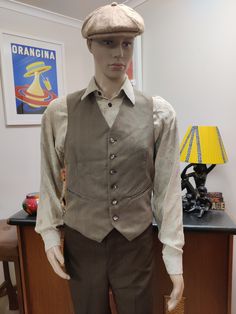 This vest may have been part of a three piece suit in its past life but now separated. The vest is 60s and in style with a high v neck and a six button closure, is in an olive with blue rust and brown stripes and a gold lining and reverse. The condition is very good Measurements are Chest 96cm Length shoulder to hem 55cm Fitted Vintage Beige Vest, Retro Fitted Vest With Button Closure, Beige Vintage Vest With Pockets, 60s Waistcoat, Brown Tailored Vintage Vest, Men's Waistcoat, Tweed Waistcoat, Suede Vest, Black Tweed