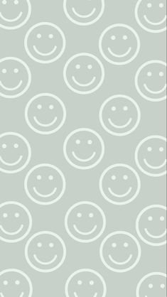 a gray and white pattern with smiley faces