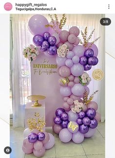 purple and gold balloons are on display in front of a large sign that says happy birthday