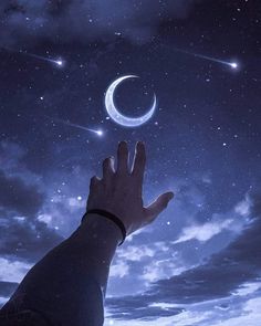 a hand reaching up to the sky at night with stars and moon in the background