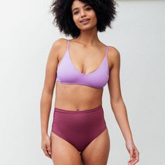 The black skinny jeans of swim bottoms. Dive in - these lux bottoms hug you in, while still showing just enough cheek to turn heads. Casual Purple Swimwear With Triangle Top, Purple Seamless Beachwear Bottoms, Purple Seamless Bottoms For Beachwear, Trendy Purple Swimwear For Poolside, Purple Beachwear Bottoms For Pool, Trendy Purple Beach Bottoms, Purple Stretch Swimwear For Yoga, Purple High Waist Swimwear For Beach, Purple High Waist Beachwear Swimwear