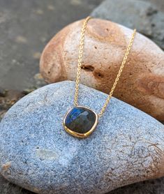 Beautiful labradorite pendant necklace. This stunning stone glows with the most amazing blue/green hues in the light. Set in the finest gold vermeil over sterling silver on an adjustable 40-45cm chain. This is the perfect piece to complement both casual and dressy looks. View our full collection of necklaces and pendants at:  https://tanviblue.etsy.com?section_id=49366284 Please note as all our gemstones are natural there are very minor variations in stone size and shape between items, which giv Minimalist Pendant, Green Hues, Necklace Minimalist, Pendant Gold, Labradorite Pendant, Gold Vermeil, Pendant Necklaces, Labradorite, Jewelry Necklace Pendant