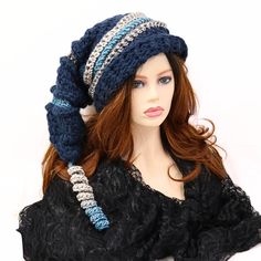 "Make winter fun with this chunky thick warm mountain ski snow hat. A little witchy, a bit of elf, and dark blue in color. I've crocheted this with bands of contrasting color and ridges. 21\" long from the top to the brim with a matching corkscrew tip, this hat is soft and can be shaped, tucked, or worn straight out. Certain to add character to your outdoor wear or gift to a friend who just loves fun things. Lots of stretch, so one size will fit most. Machine wash cold, lay flat to dry." Winter Brimmed Hat One Size, One-size Winter Brimmed Hats, One Size Winter Brimmed Hat, Winter Yarn Bonnet With Brim, Adjustable Warm Winter Costume Hats And Headpieces, Winter Brimmed Yarn Hat, Adjustable Knitted Winter Costume Hats And Headpieces, Winter Yarn Brimmed Hat, Adjustable Knitted Costume Hats And Headpieces For Winter