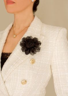 Introducing our exquisite Midnight Rose Brooch, the perfect final touch to any outfit. This is a timeless piece that embodies elegance, crafted with meticulous attention to detail. The brooch features mesh petals, delicately shaped to capture the essence of a real rose. Designed to be versatile, this brooch can be worn on your favorite blazer, coat, or dress to add a touch of sophistication and drama. Wear it as a focal point on a lapel, collar, or even a hat, and instantly elevate your ensemble with an air of mystery and elegance. The gold safety clasp pin ensures that the brooch stays in place, offering both style and functionality. It can be a meaningful gift for someone special, presented in a beautiful clear box with rose gold crinkle cut paper and finished with a satin ribbon. Midnight Rose, Rose Brooch, Real Rose, Clear Box, Pacific Palisades, Cut Paper, Final Touch, Blazer Coat, Lapel Collar