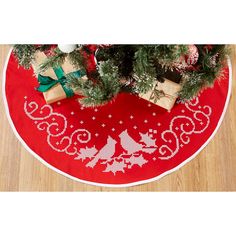 a christmas tree skirt with presents on it